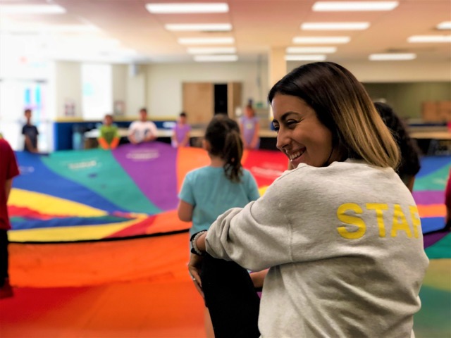 Teacher smiling in the school gym